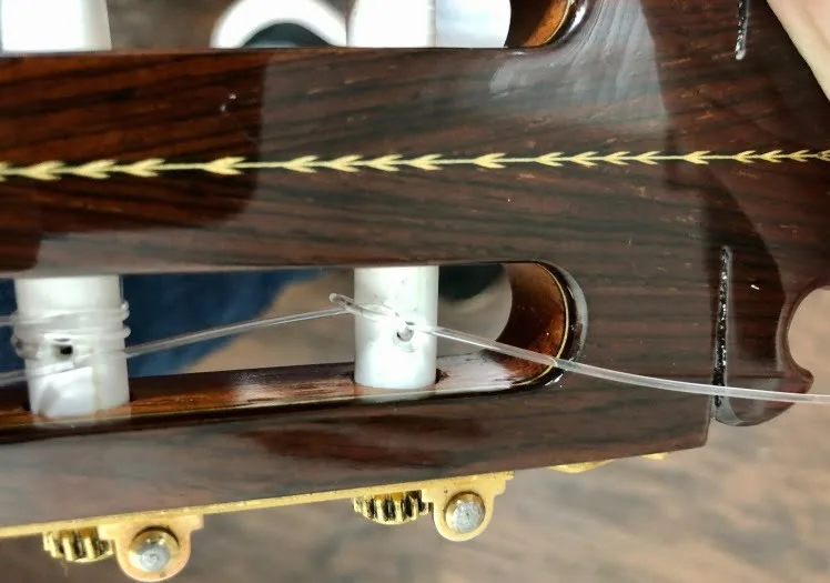 Guitar restringing